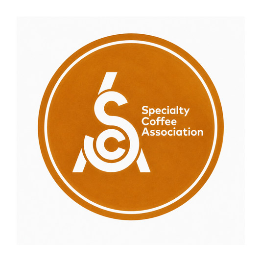 Specialty Coffee Association logo on a brown background